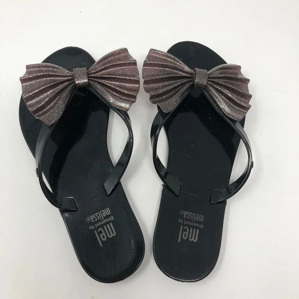 Melissa Mel Harmonic Bow Vi INF Flip Flops Girls 1 Black Glitter Scented